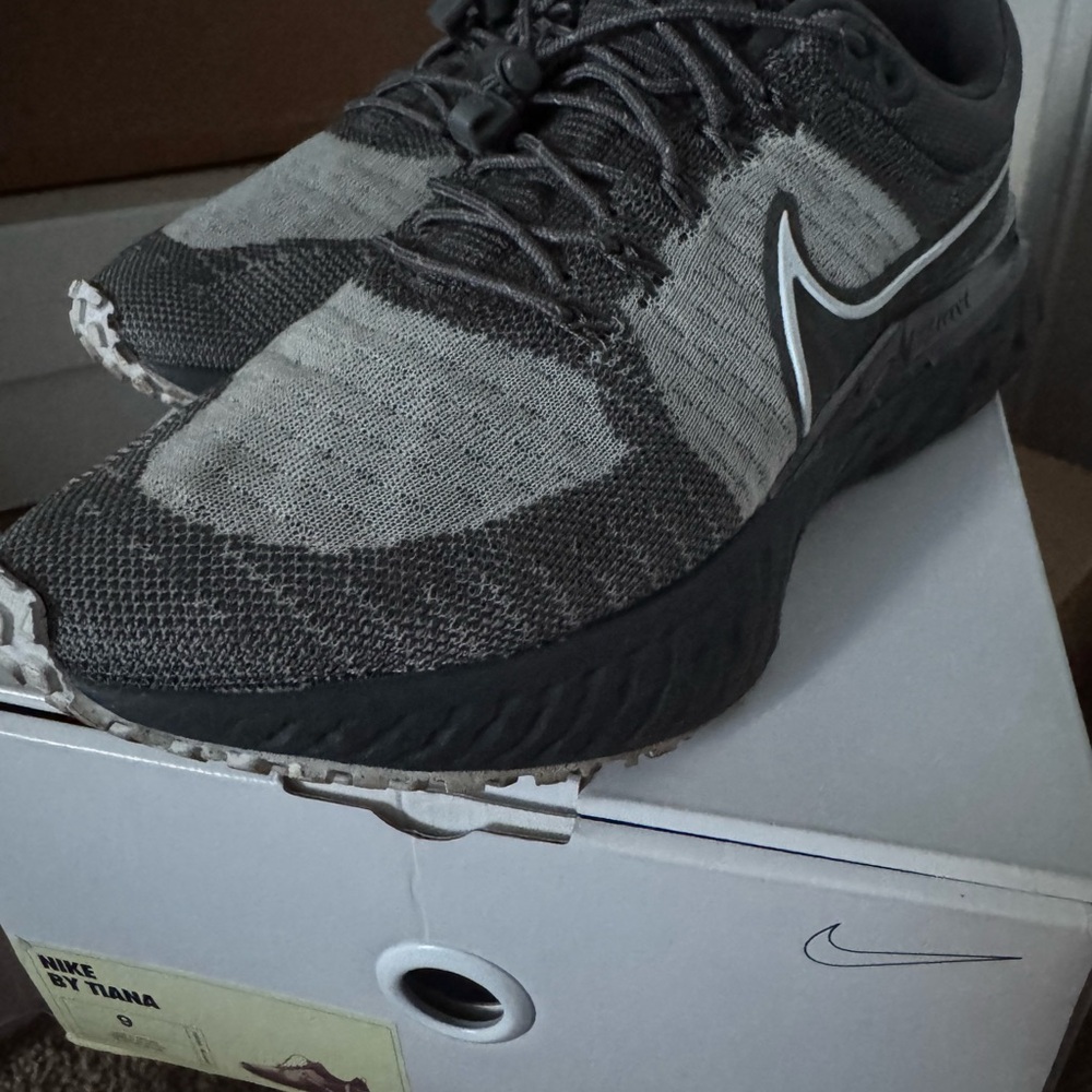 Nike Women Gray Sneakers. 
.